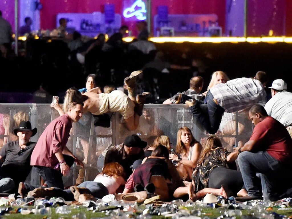 crowd disperses as emergency vehicles arrive at las vegas strip shooting scene