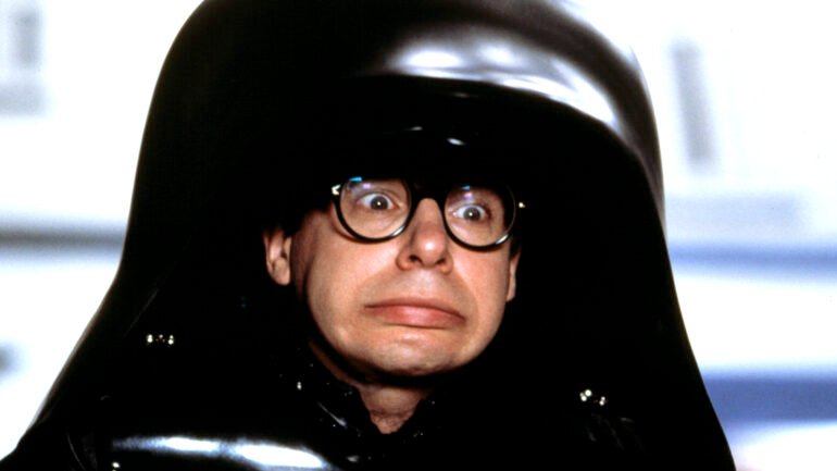rick moranis in dark helmet costume on movie set